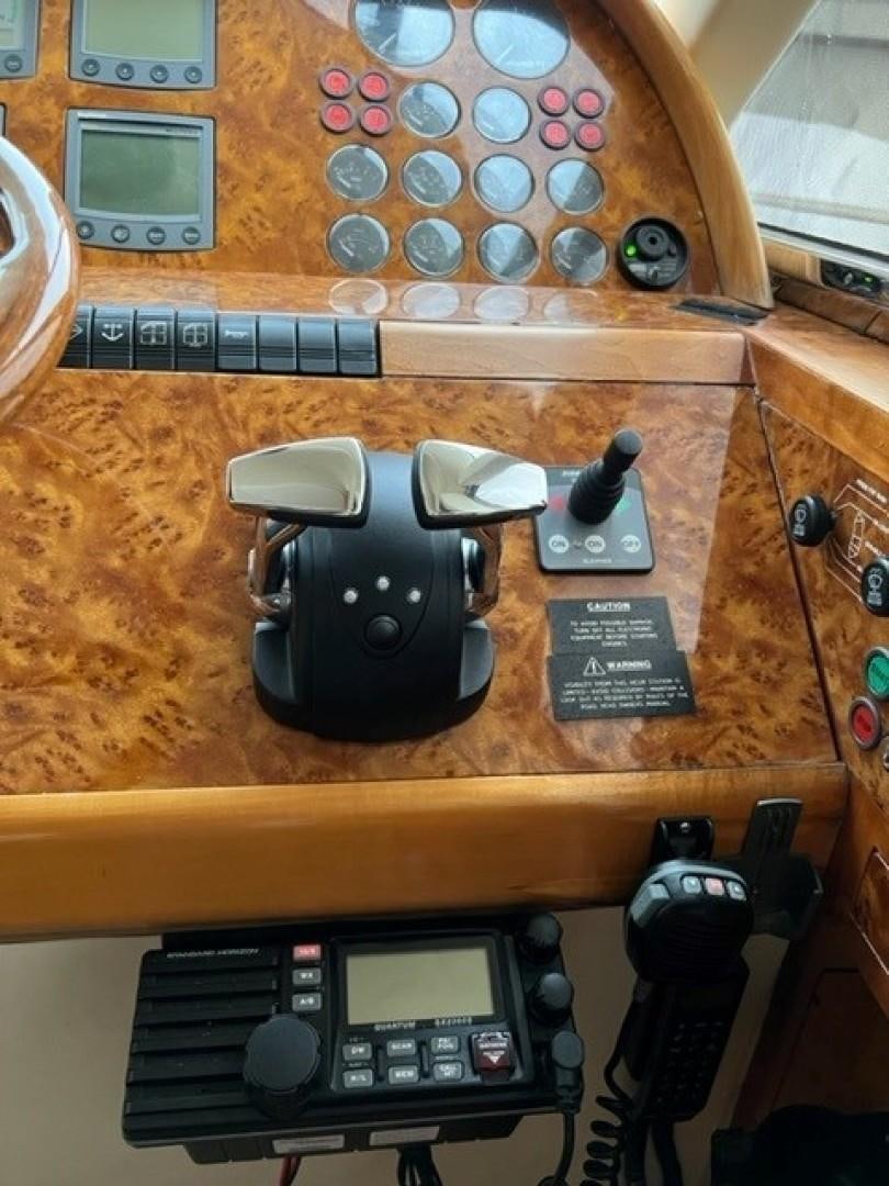 a camera on a table aboard JOIE DU ROI Yacht for Sale