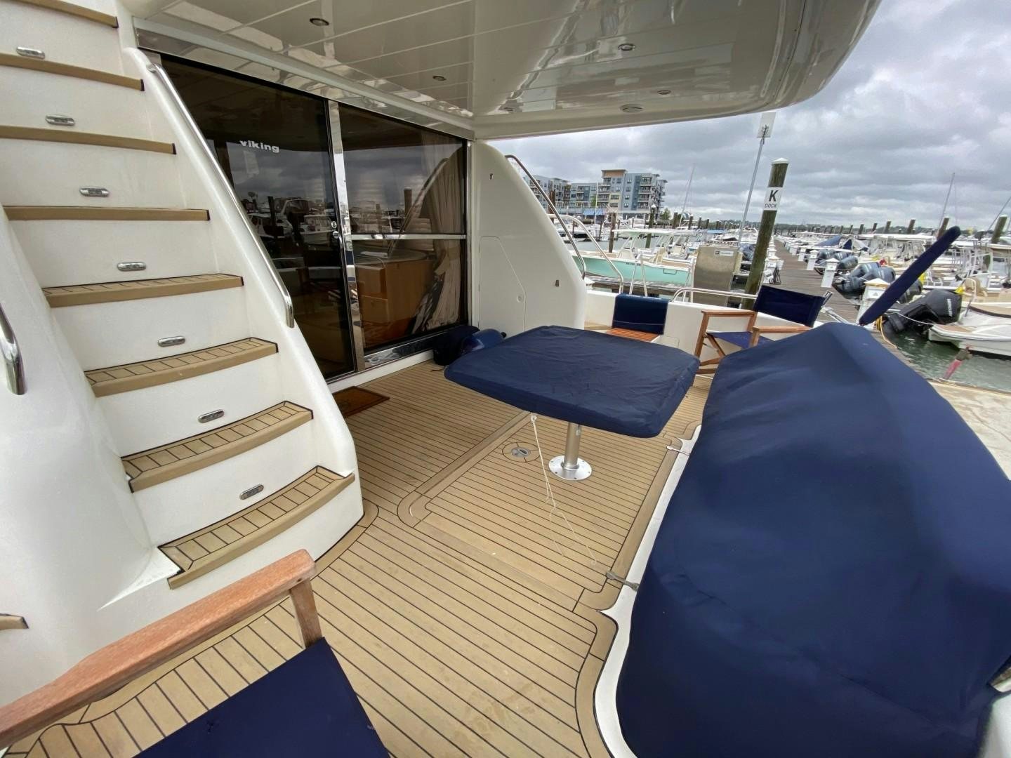 a boat with a deck and a bench aboard JOIE DU ROI Yacht for Sale
