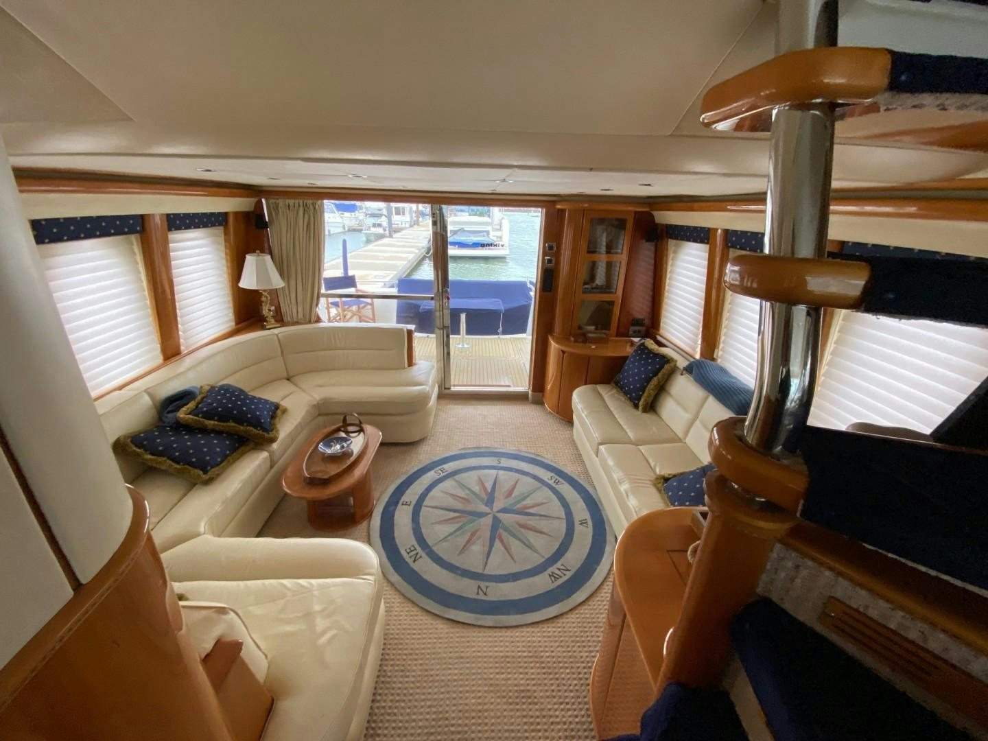 a living room with a large window aboard JOIE DU ROI Yacht for Sale
