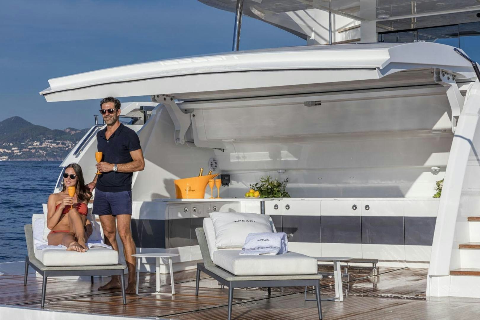 a man and a woman standing on a boat aboard NONE Yacht for Sale