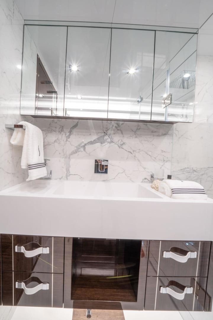 a bathroom with a sink and mirror aboard NONE Yacht for Sale
