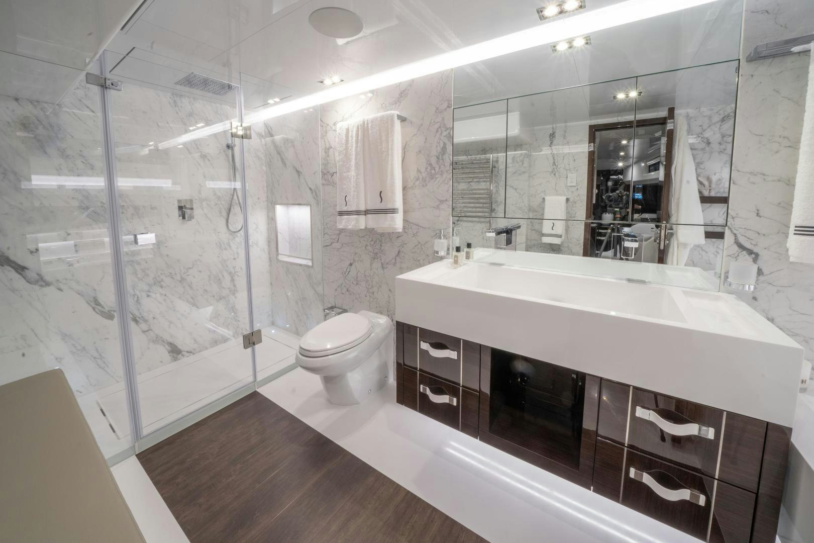 a bathroom with a large mirror aboard NONE Yacht for Sale