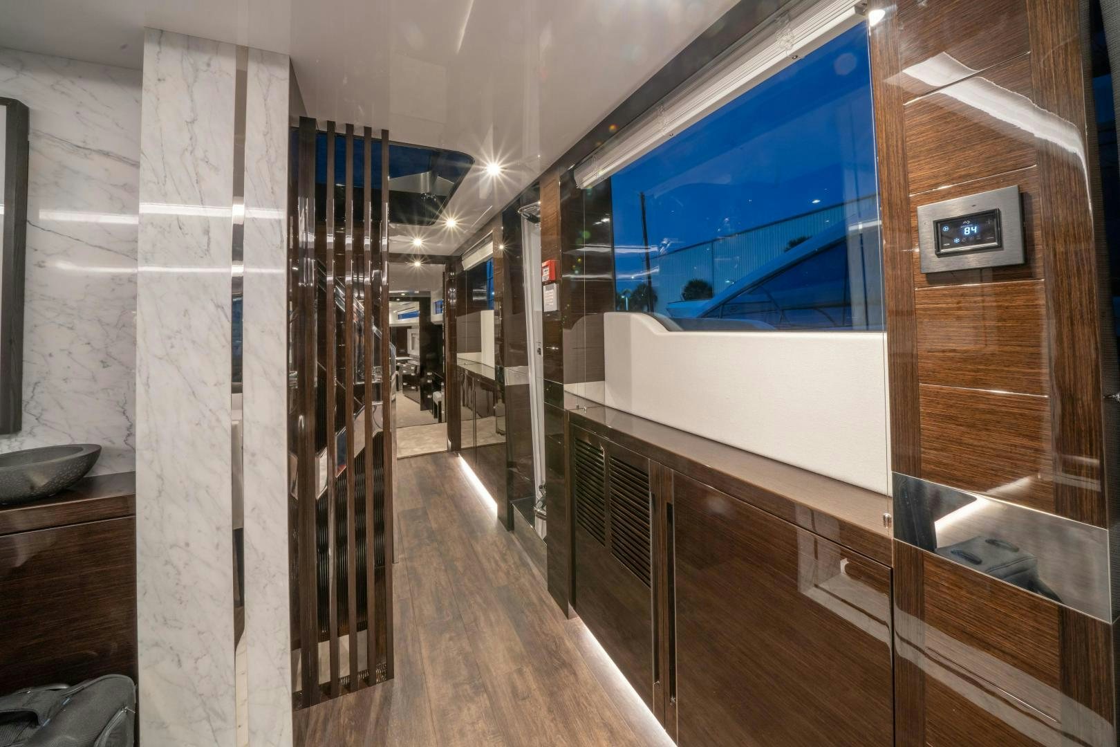 a room with a large glass window aboard NONE Yacht for Sale