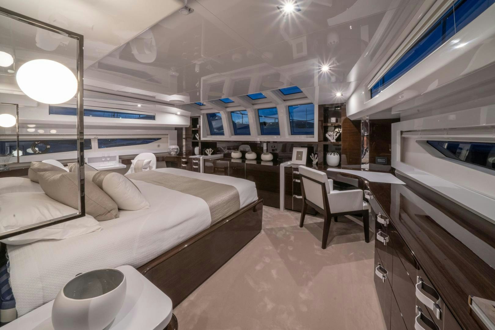 a room with a bed and a table aboard NONE Yacht for Sale