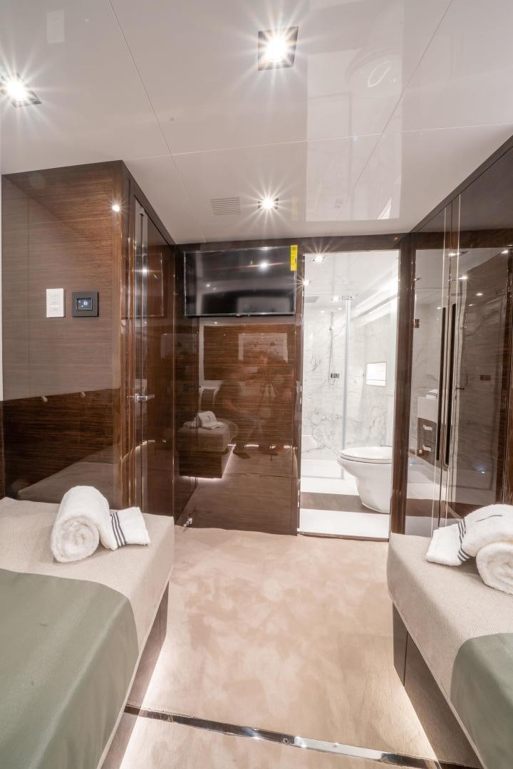 a bathroom with a large glass shower aboard NONE Yacht for Sale