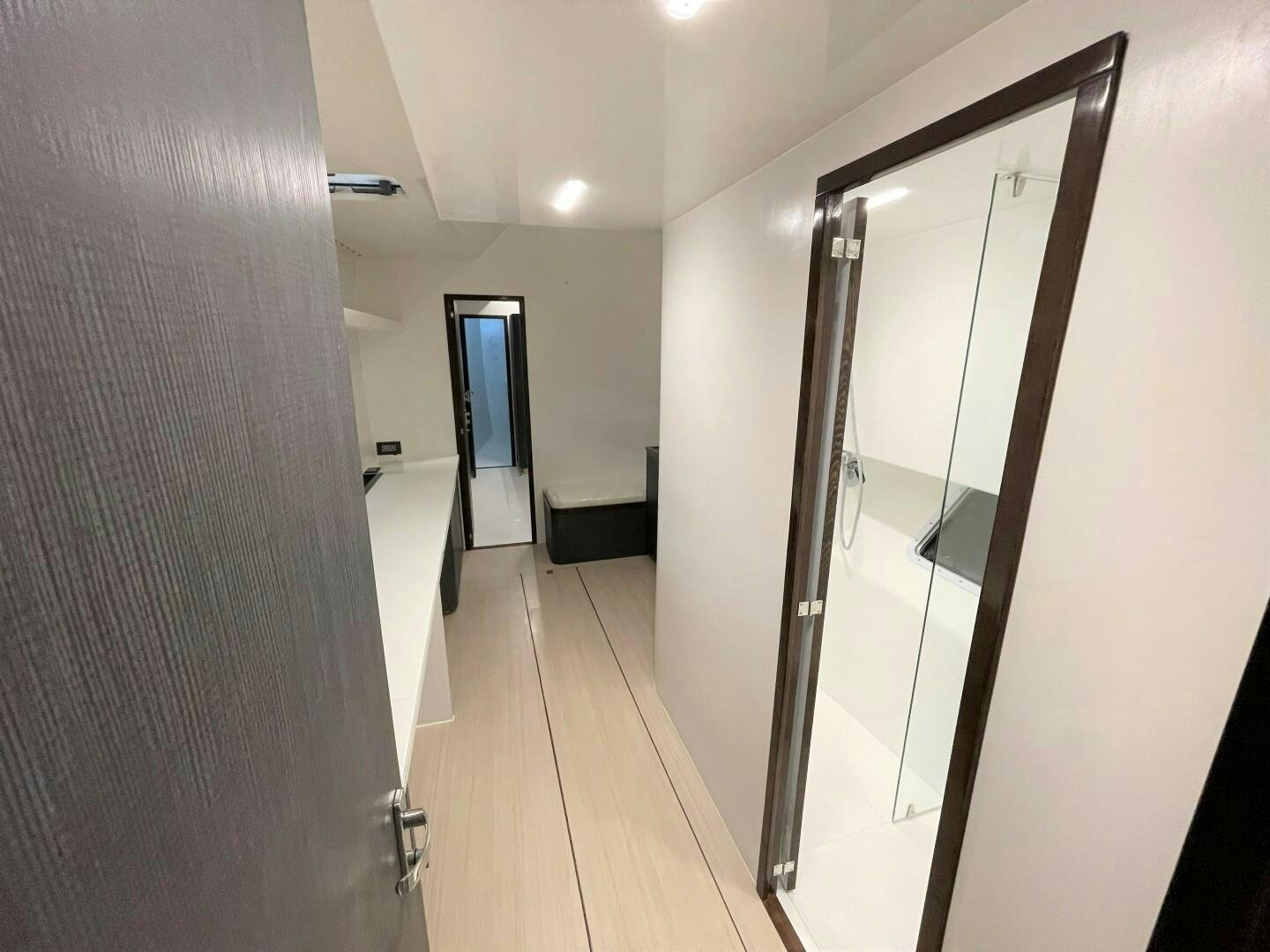 a hallway with a glass door aboard SKYE Yacht for Sale