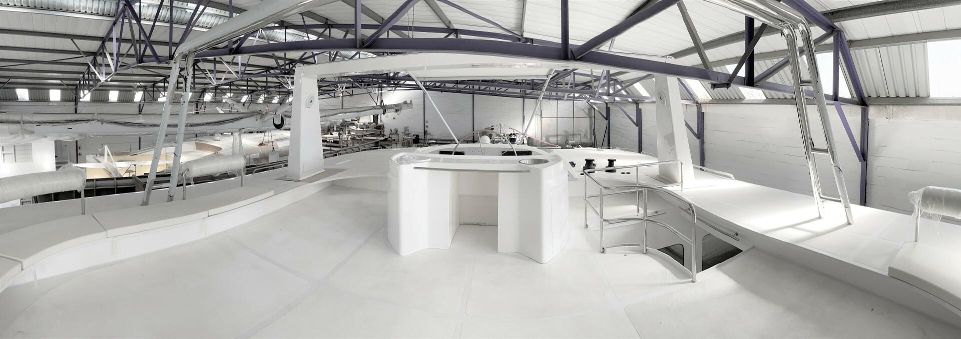 a room with tables and chairs aboard SKYE Yacht for Sale