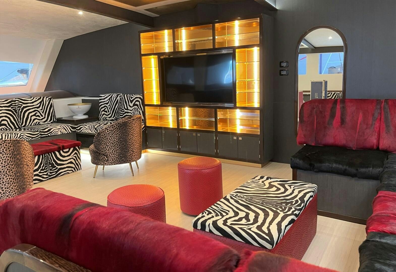 a living room with a fireplace aboard SKYE Yacht for Sale