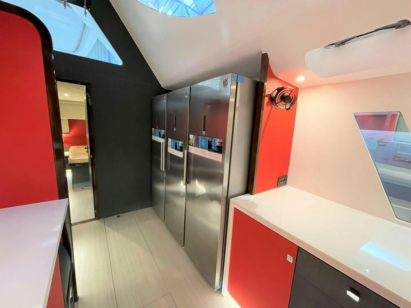 a room with a large refrigerator aboard SKYE Yacht for Sale