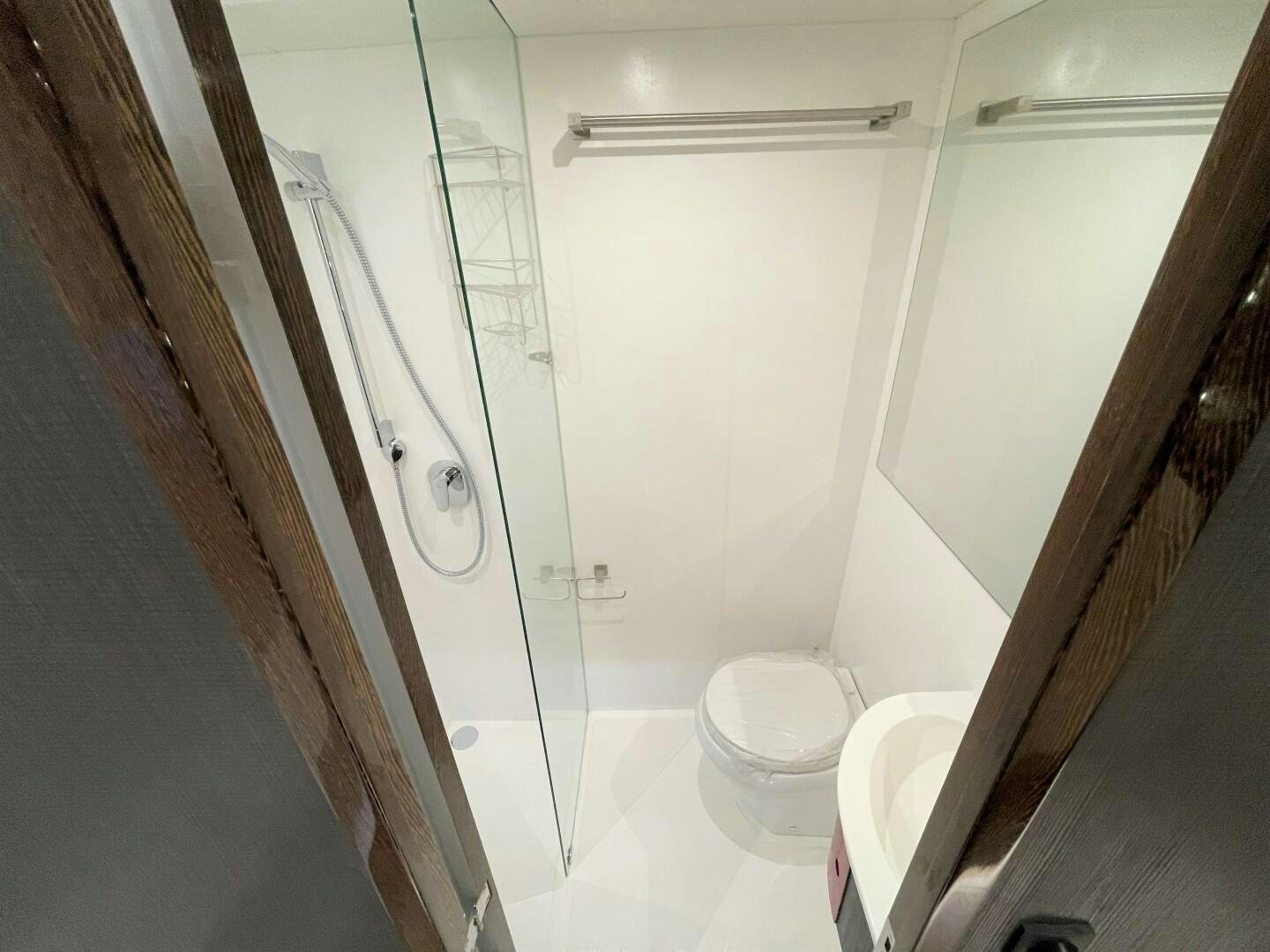 a bathroom with a shower unit aboard SKYE Yacht for Sale