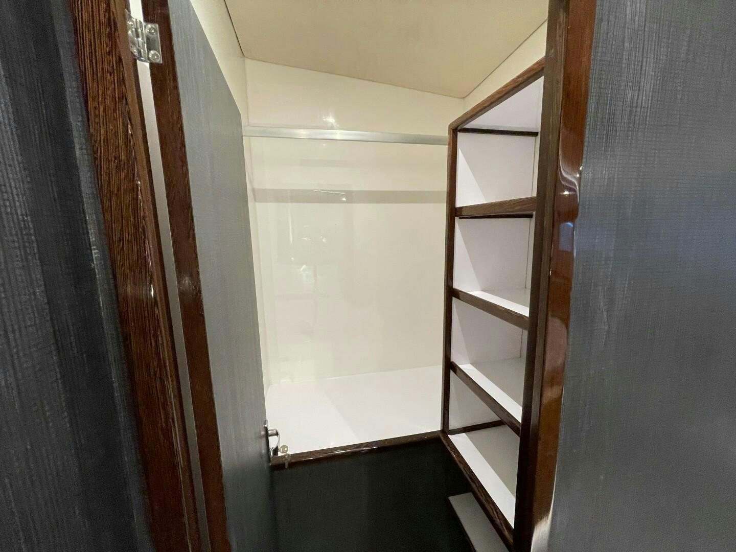 a white door with a shelf aboard SKYE Yacht for Sale