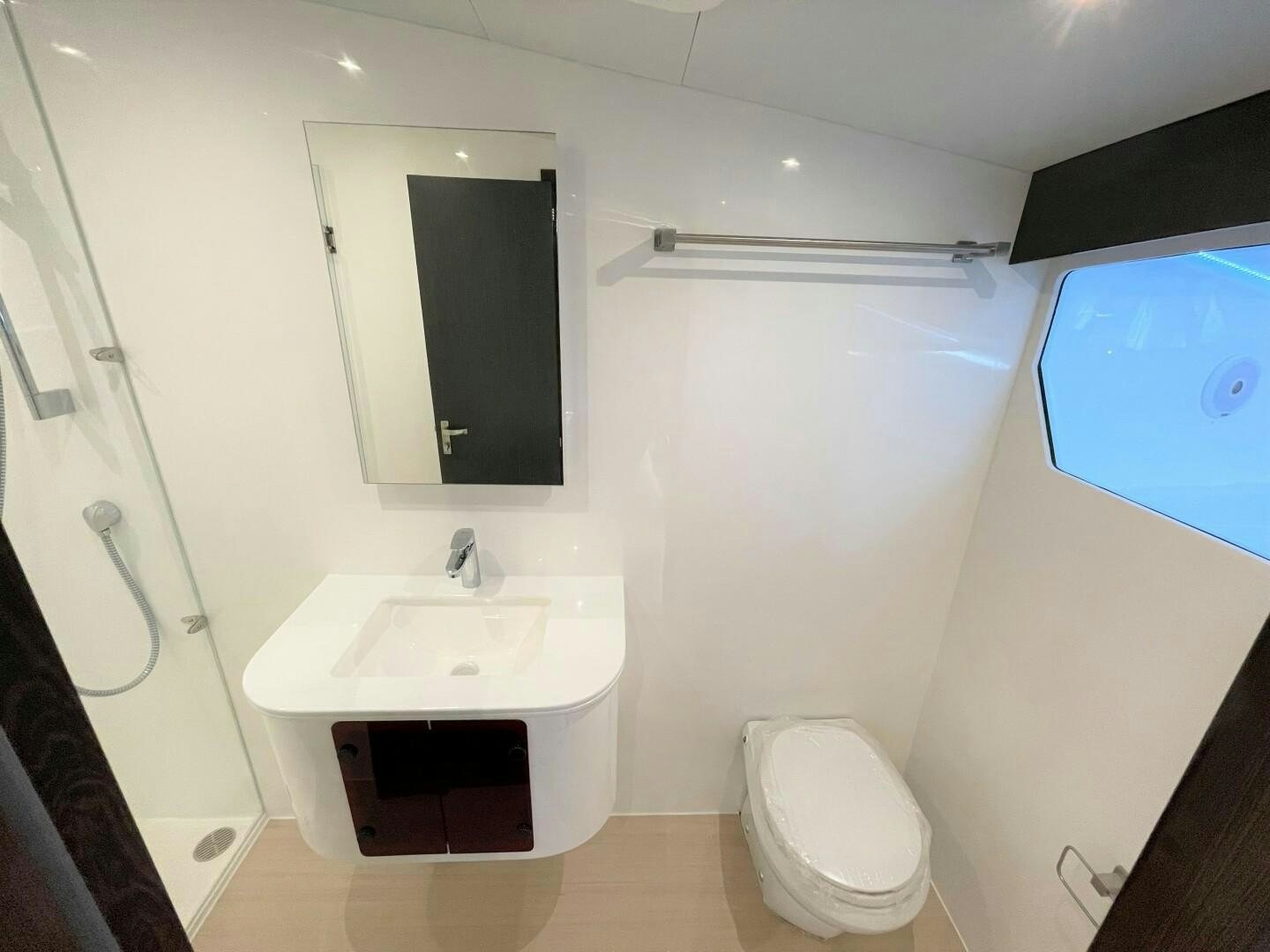 a bathroom with a sink and toilet aboard SKYE Yacht for Sale