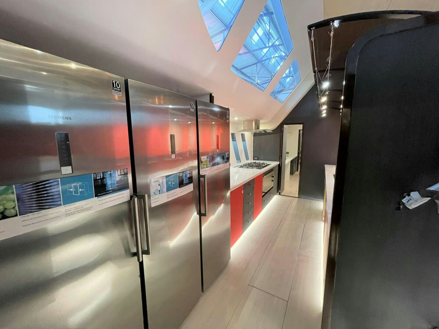 a hallway with a large mirror aboard SKYE Yacht for Sale