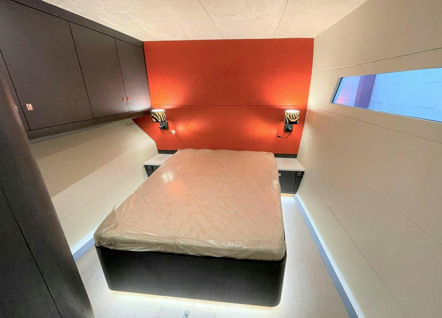 a bed in a room aboard SKYE Yacht for Sale