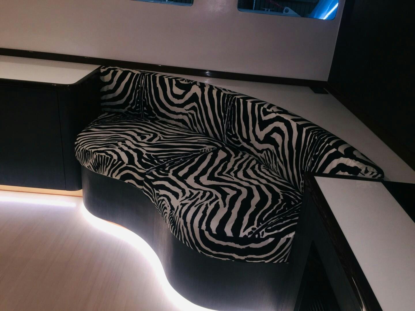 a black and white tattoo on a person's arm aboard SKYE Yacht for Sale