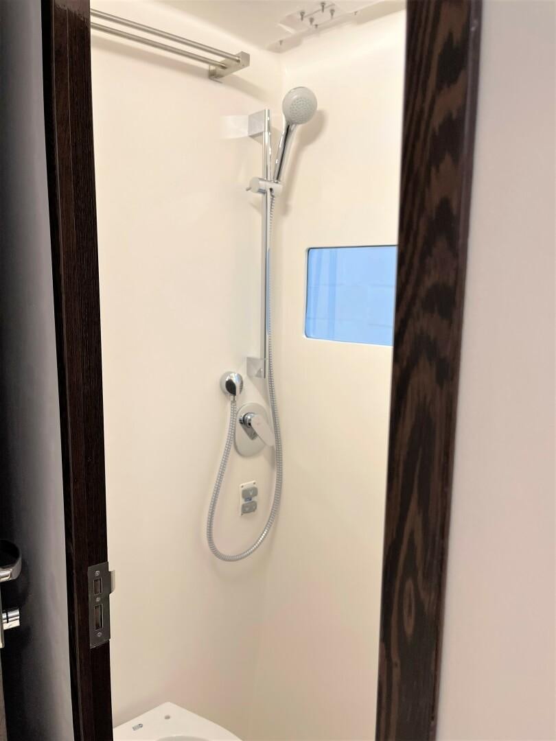 a shower head with a blue screen aboard SKYE Yacht for Sale