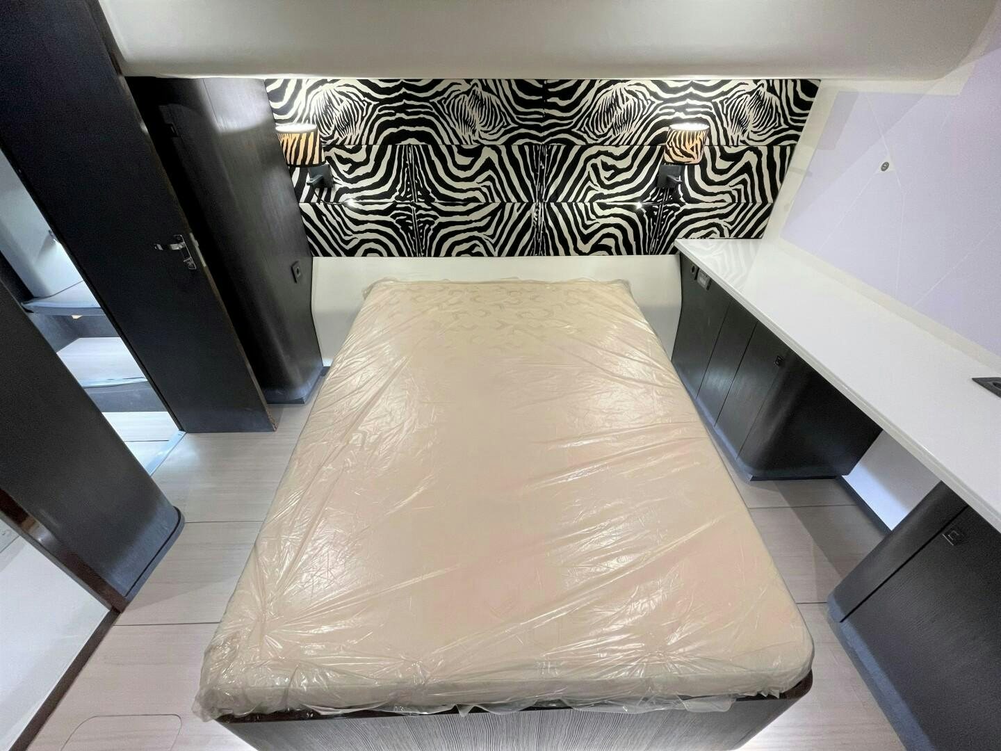 a bed with a cover aboard SKYE Yacht for Sale