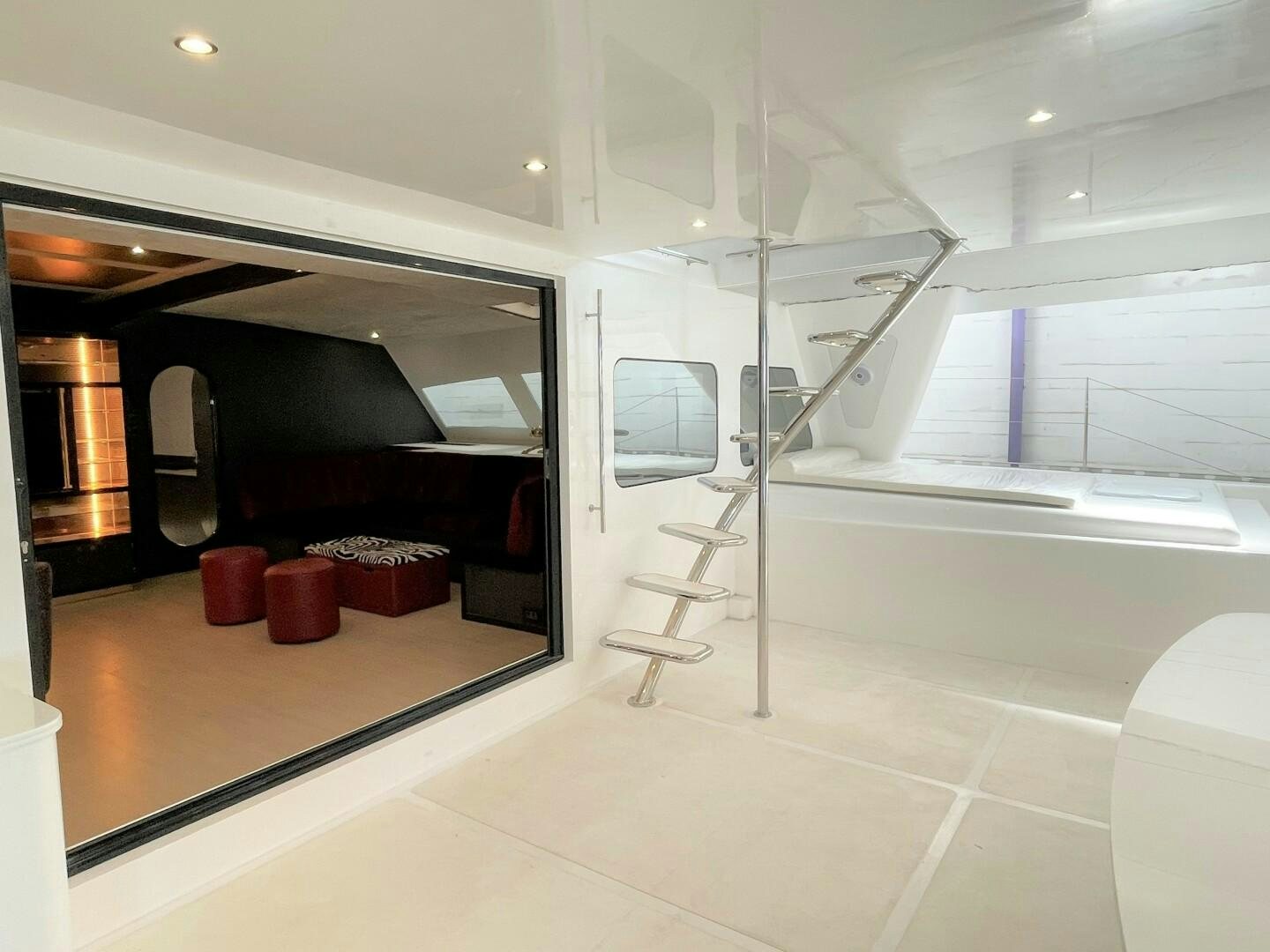 a room with a ladder and a window aboard SKYE Yacht for Sale