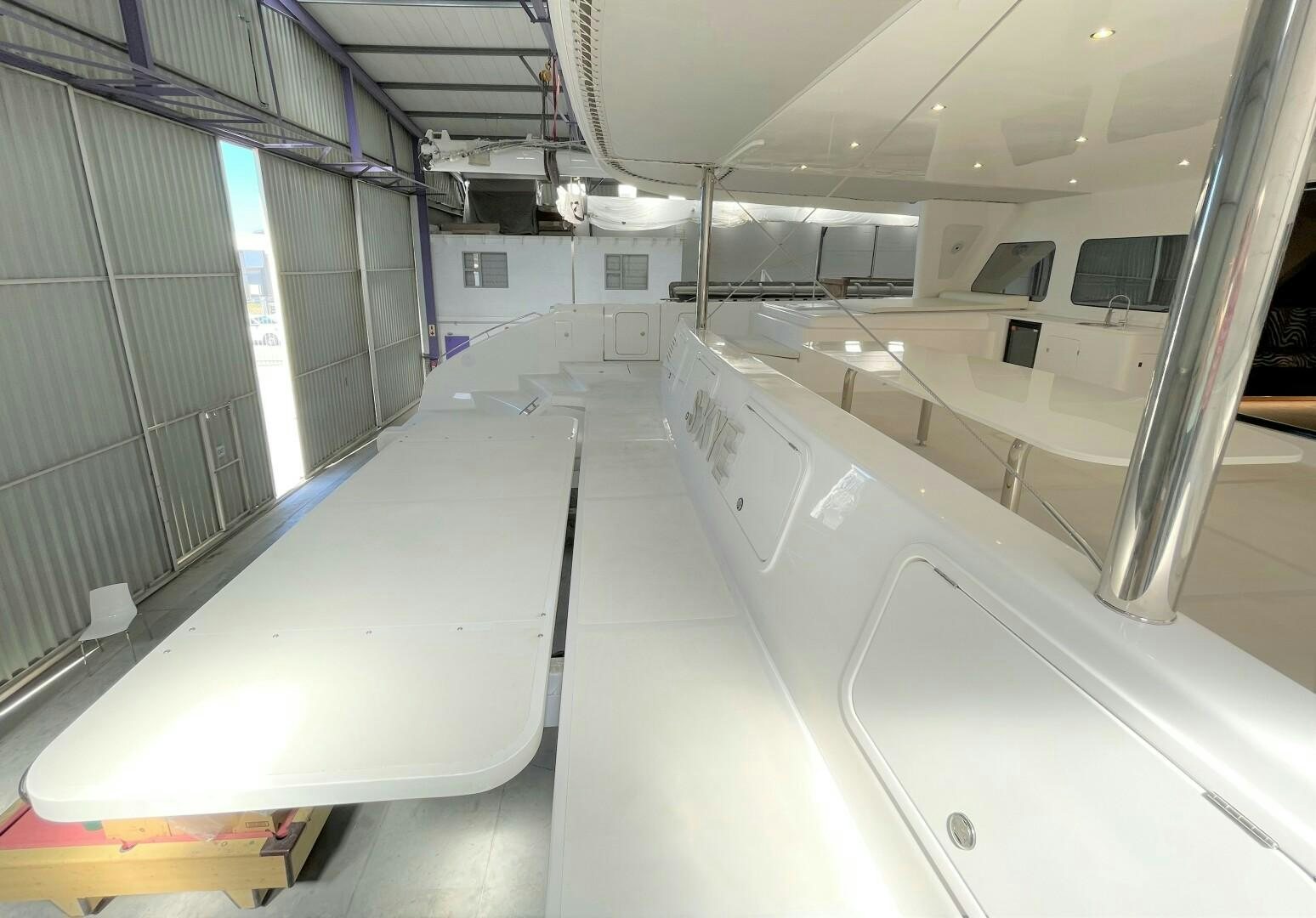 a room with a row of white pipes and a wall with a window aboard SKYE Yacht for Sale