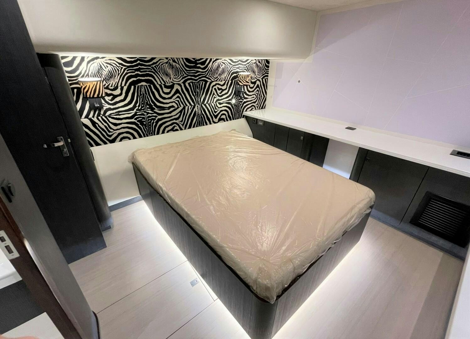 a bed in a room aboard SKYE Yacht for Sale