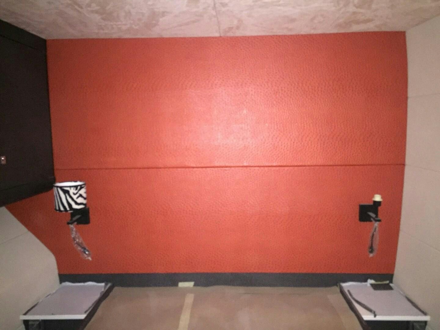 a red wall with a white object on it aboard SKYE Yacht for Sale