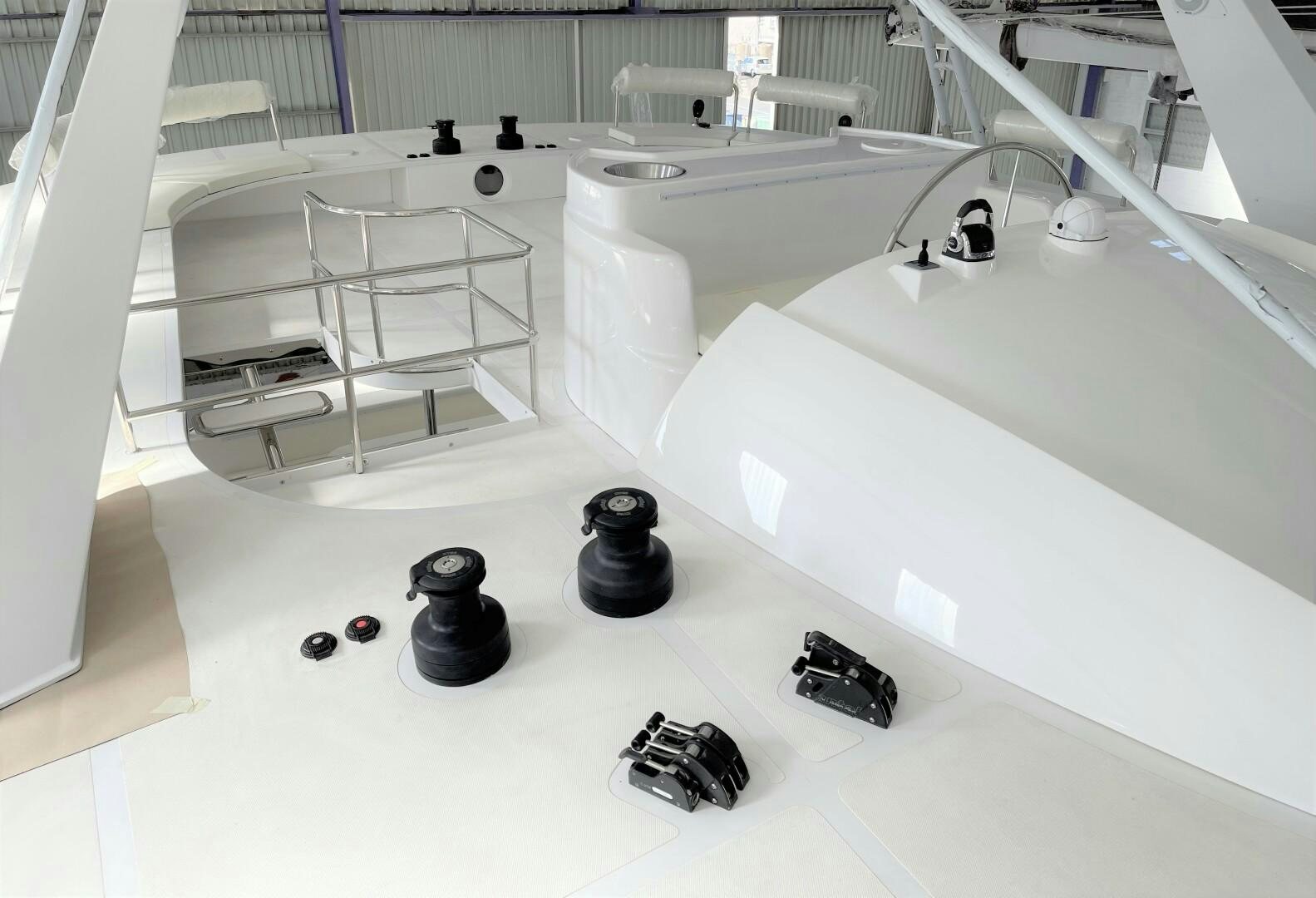 a white room with a white table and chairs aboard SKYE Yacht for Sale