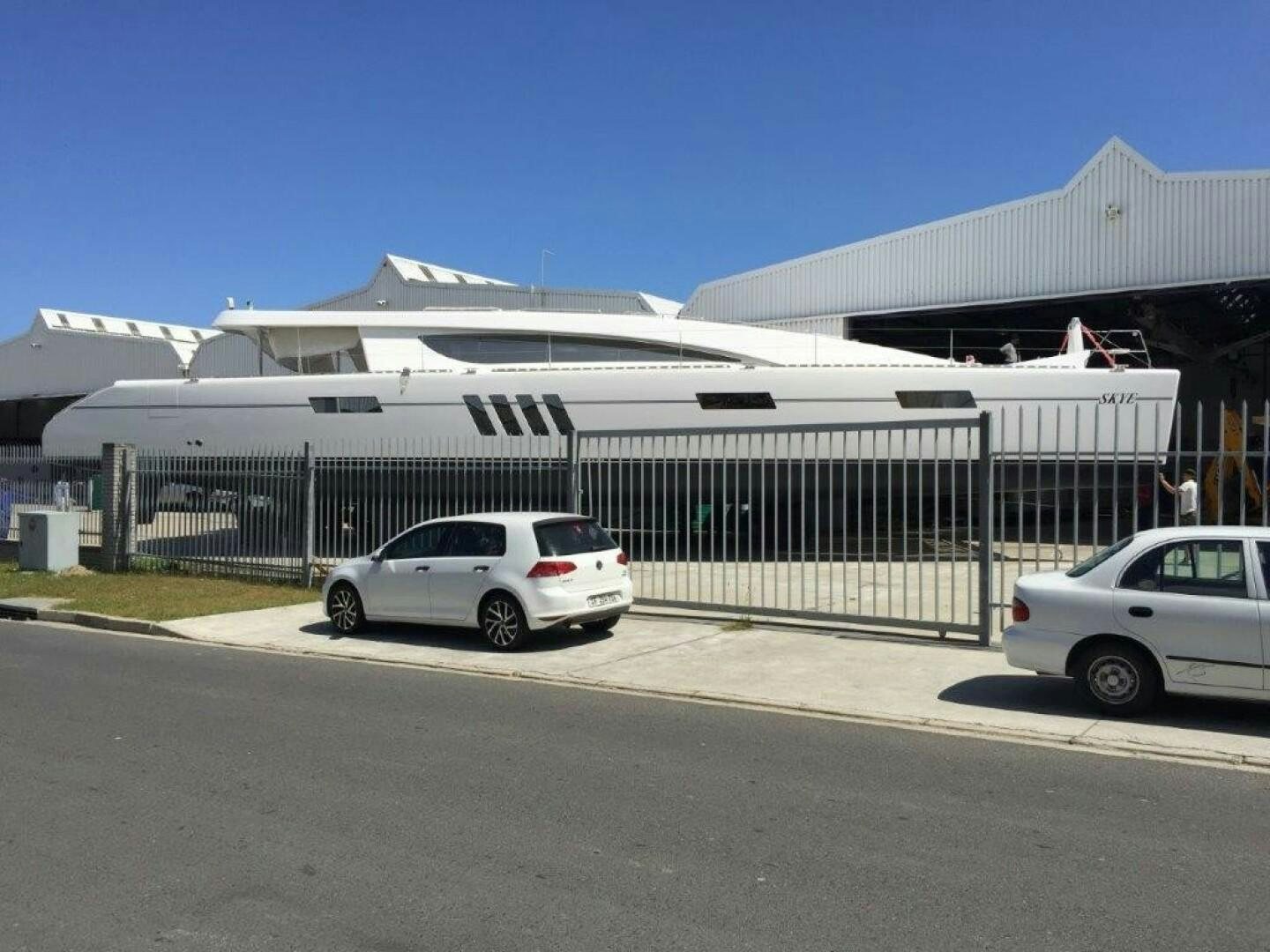 cars parked in front of a building aboard SKYE Yacht for Sale