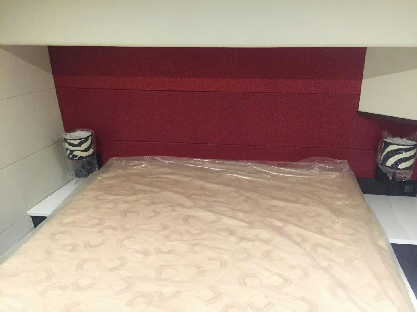 a bed with a white sheet aboard SKYE Yacht for Sale