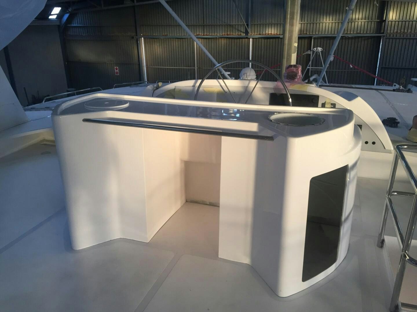 a white rectangular object with a black handle on a black surface aboard SKYE Yacht for Sale