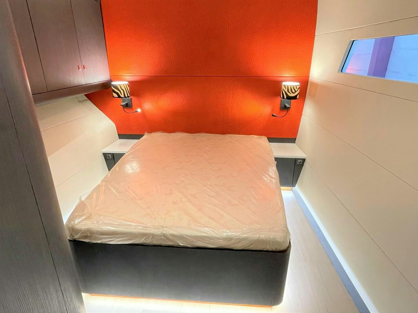 a bed in a room aboard SKYE Yacht for Sale