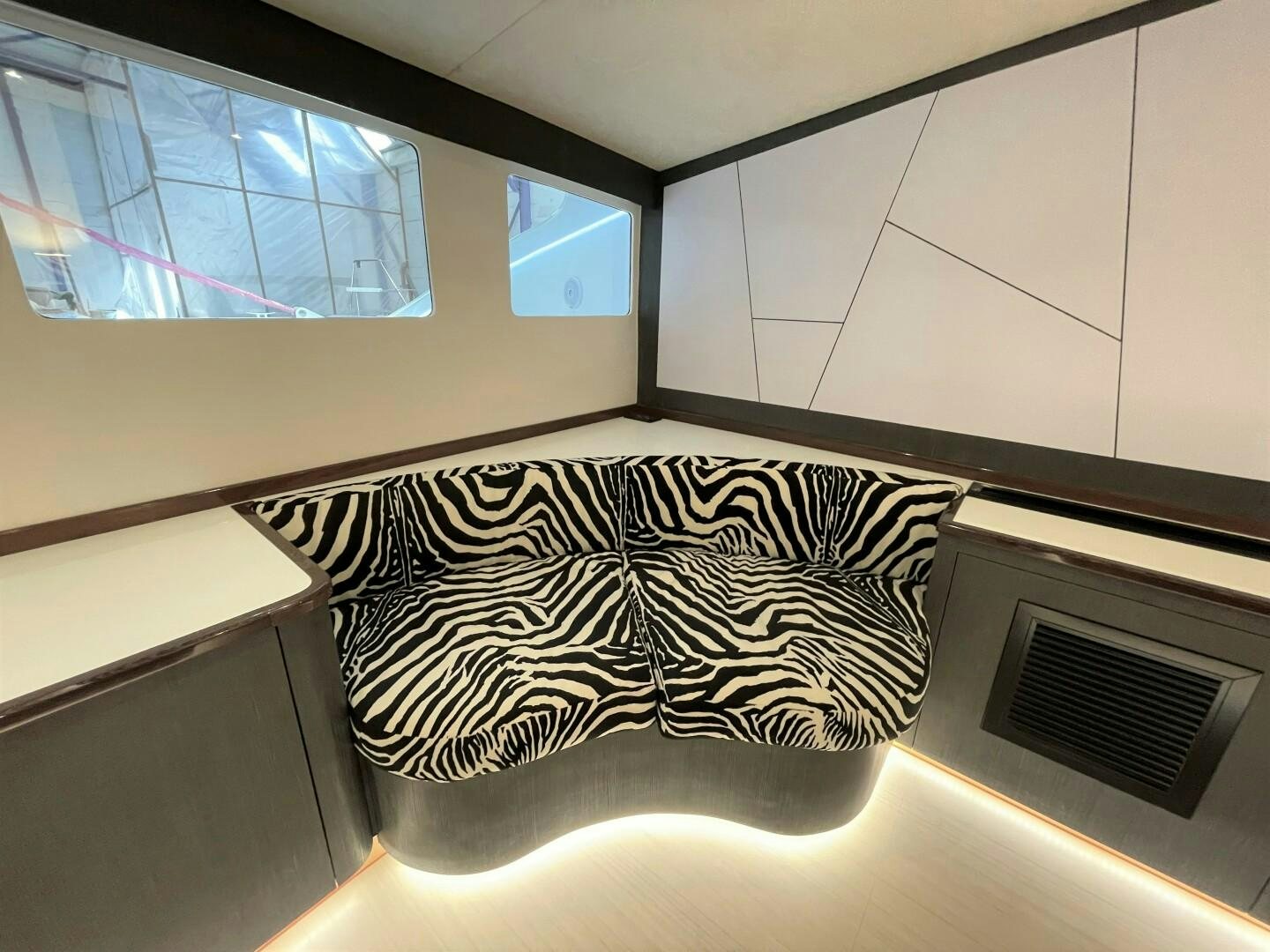 a black and white design on a white wall aboard SKYE Yacht for Sale