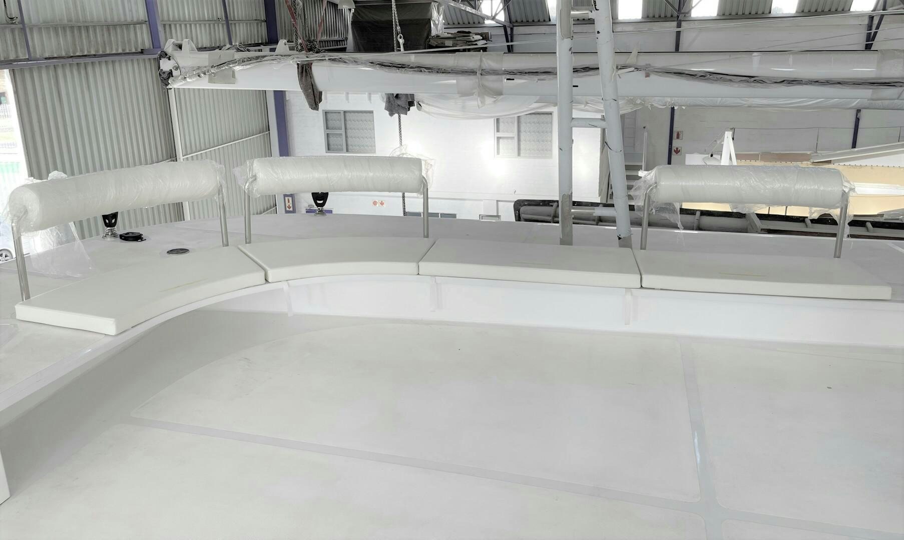 a large white room with white walls aboard SKYE Yacht for Sale