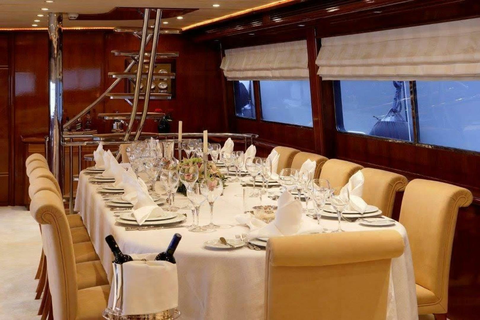 a table set for a dinner aboard CORVUS Yacht for Sale