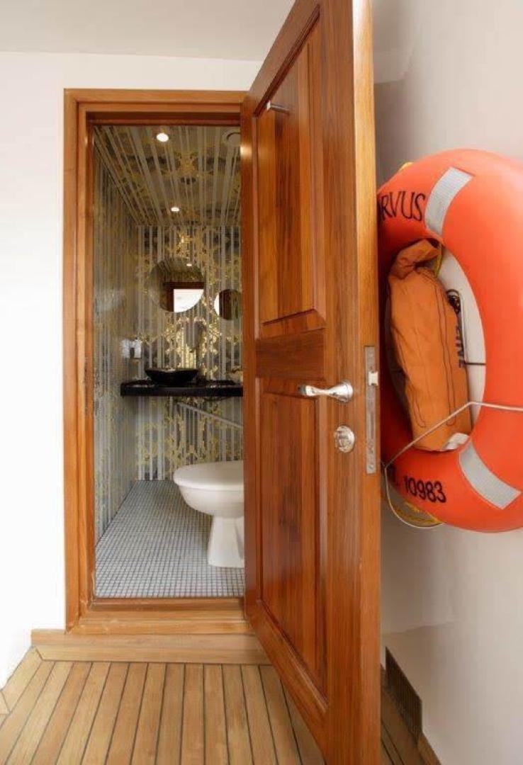 a toilet with a cartoon character on it aboard CORVUS Yacht for Sale