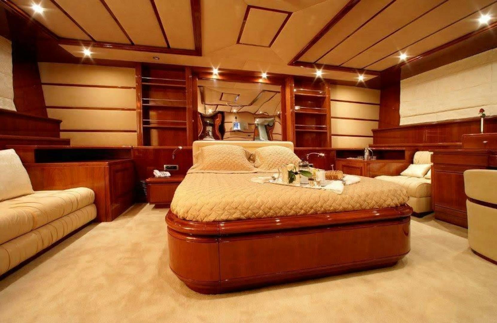 a large bed in a room aboard CORVUS Yacht for Sale