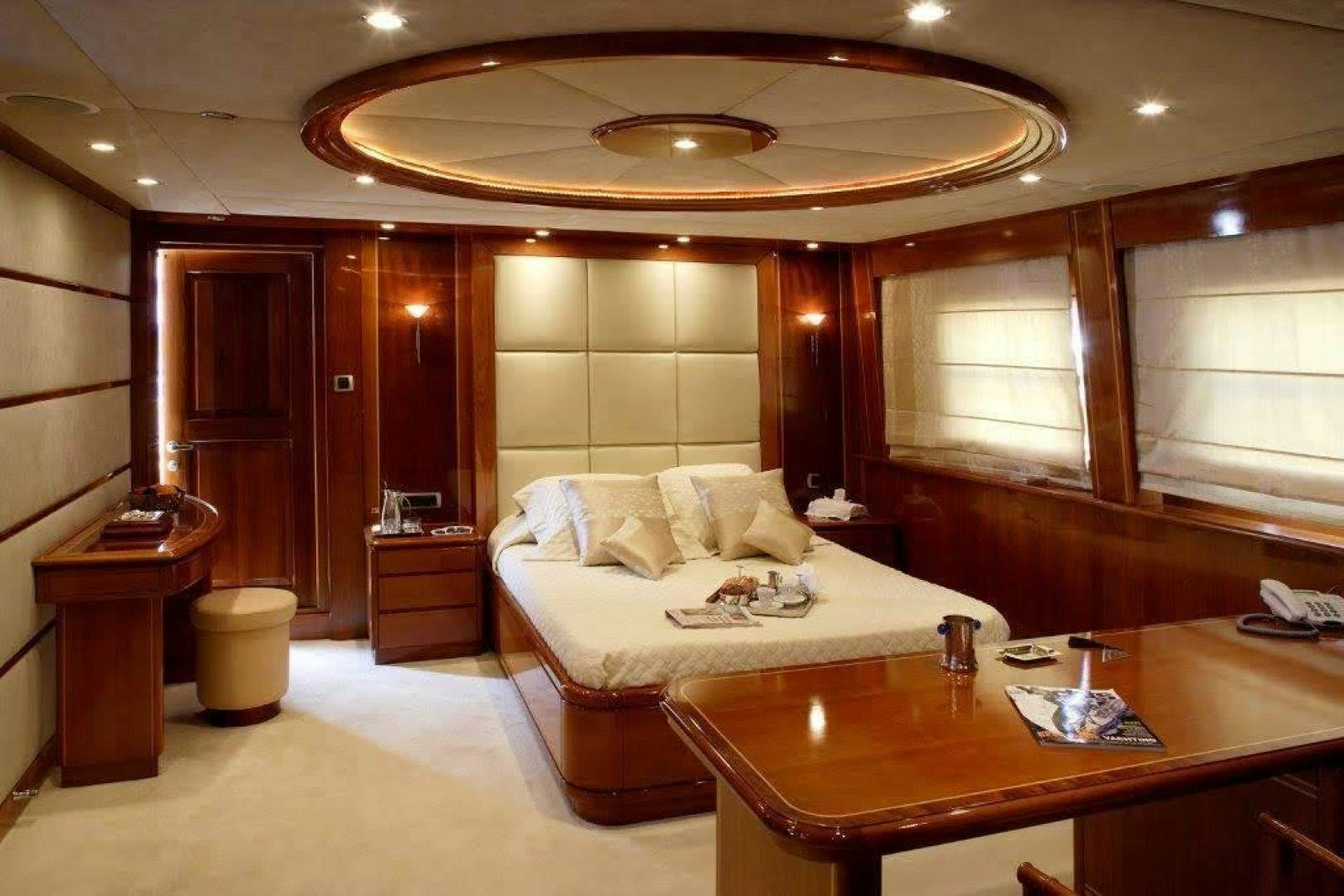 a large hotel room with a bed aboard CORVUS Yacht for Sale
