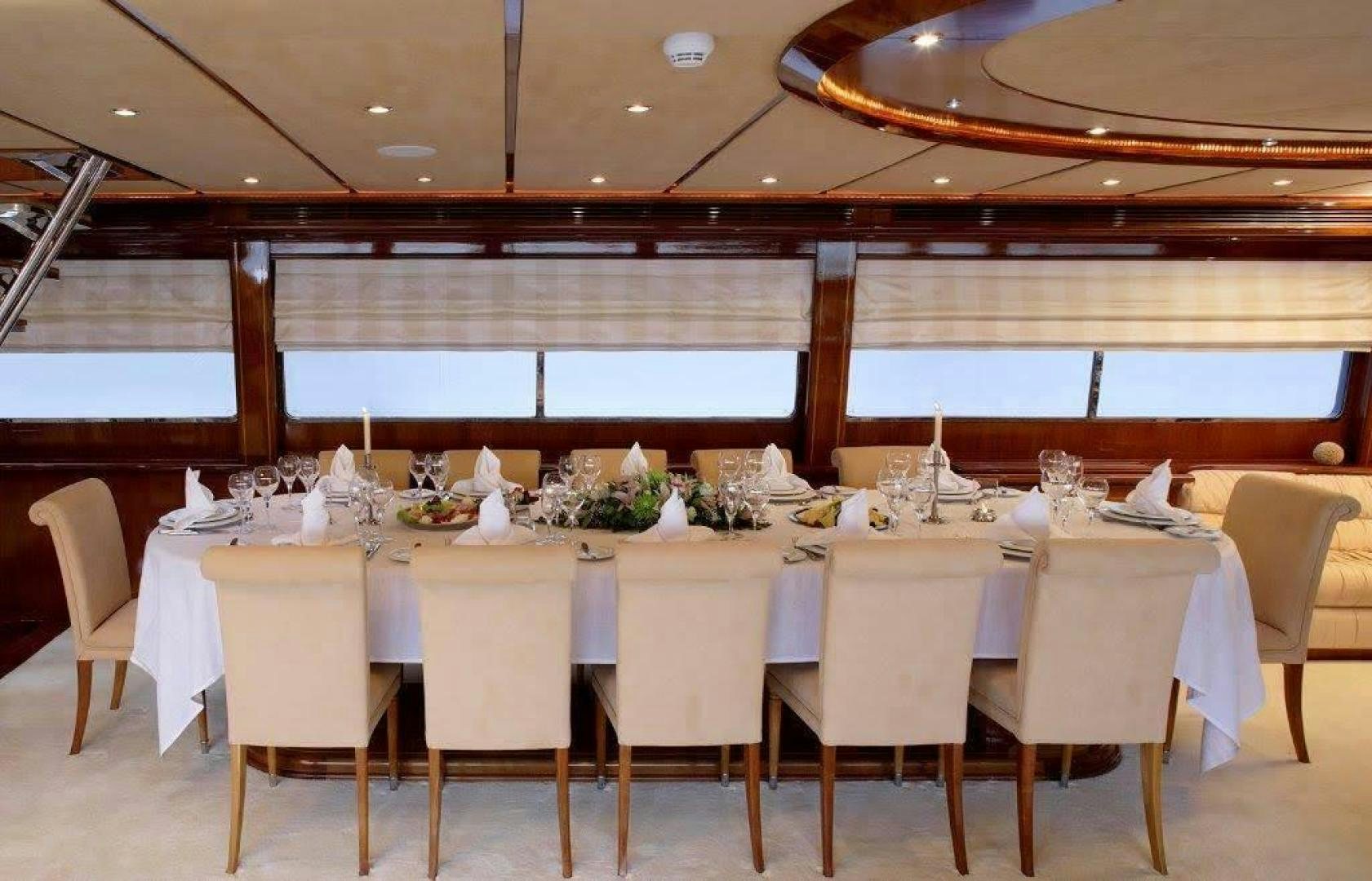 a table set for a banquet aboard CORVUS Yacht for Sale