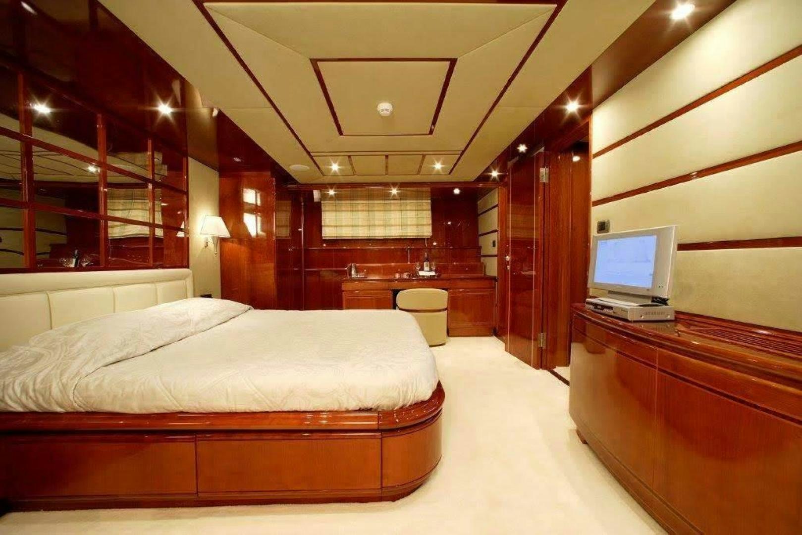 a room with a bed and a laptop aboard CORVUS Yacht for Sale