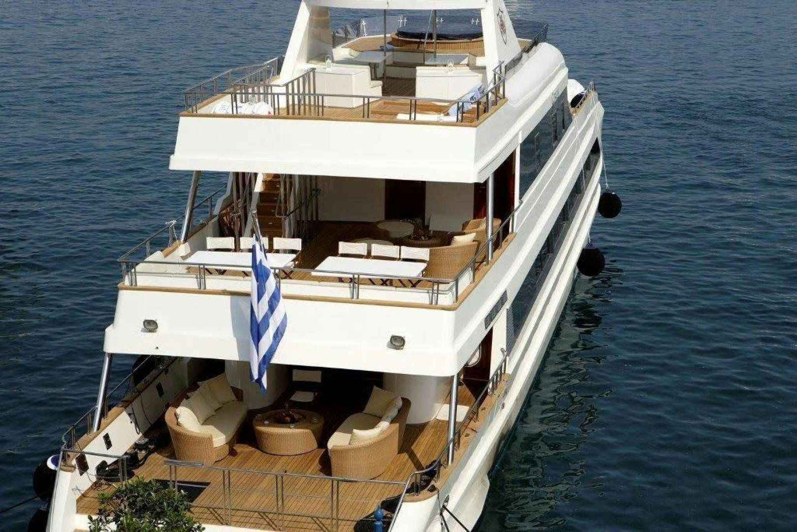 a large white boat on the water aboard CORVUS Yacht for Sale