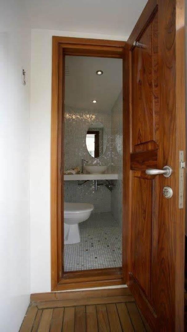 a bathroom with a sink and a toilet aboard CORVUS Yacht for Sale