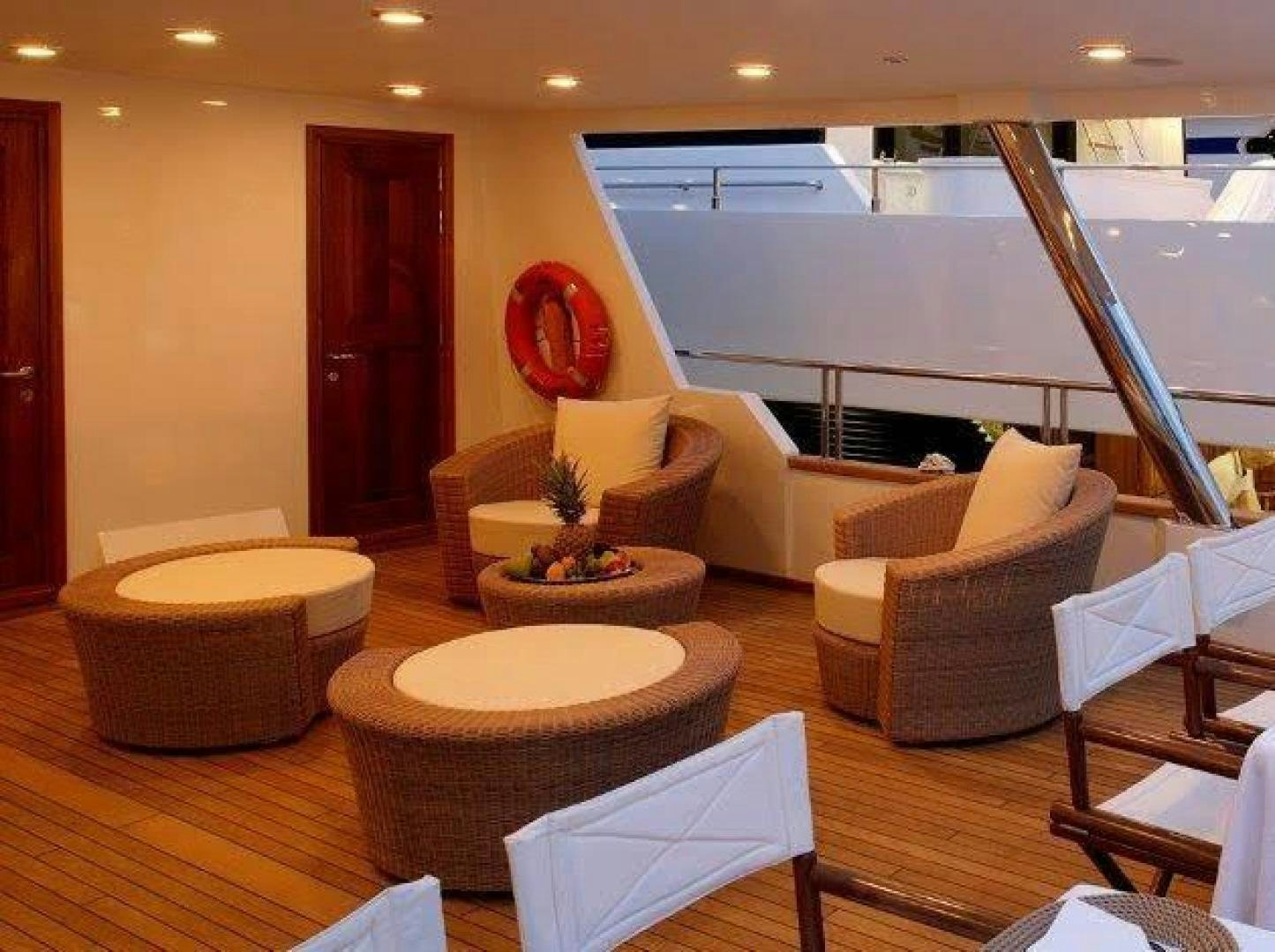 a living room with a large window aboard CORVUS Yacht for Sale