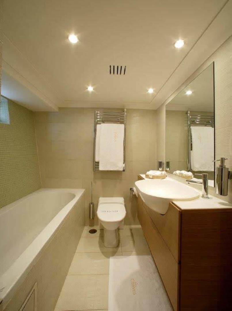 a bathroom with a toilet and a sink aboard CORVUS Yacht for Sale