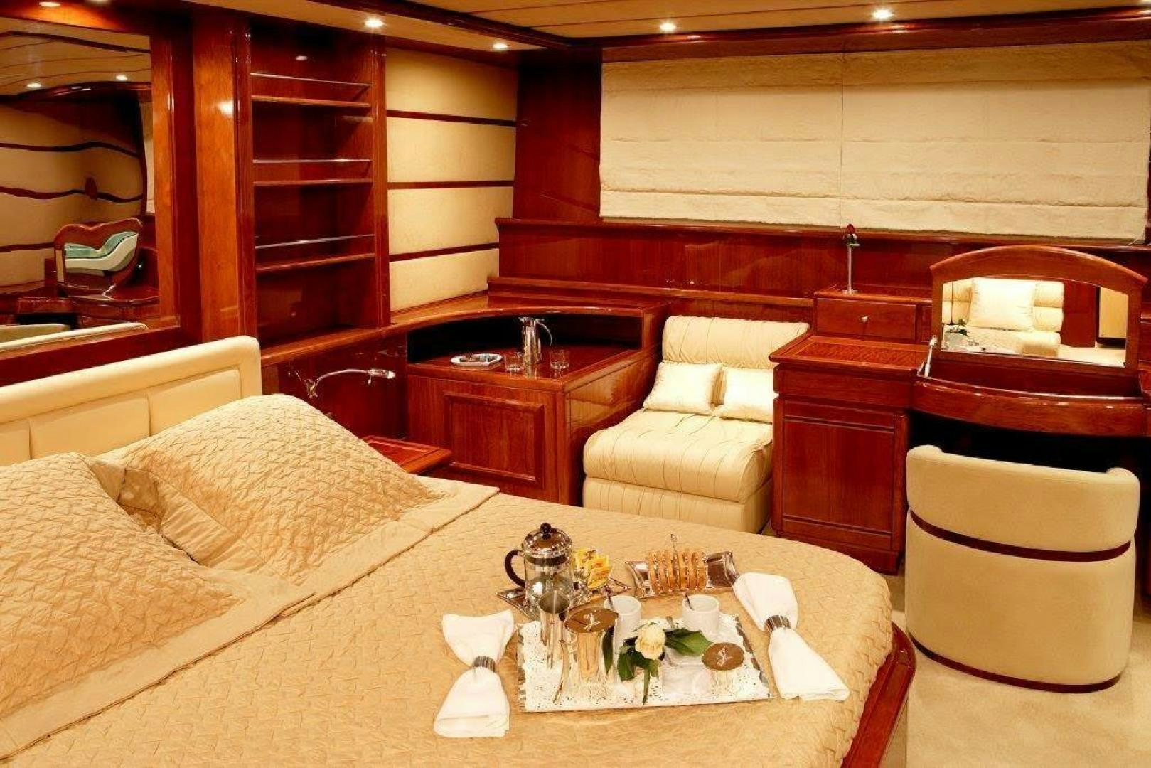 a room with a table and chairs aboard CORVUS Yacht for Sale
