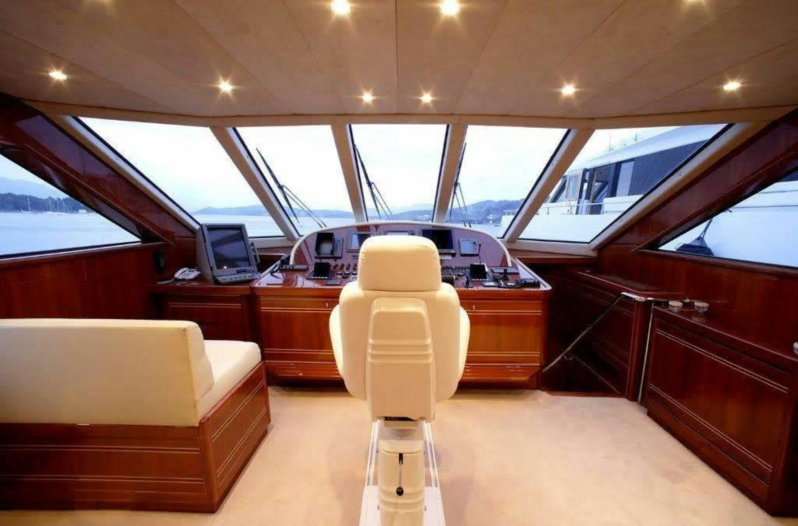 a car with a large white hood aboard CORVUS Yacht for Sale