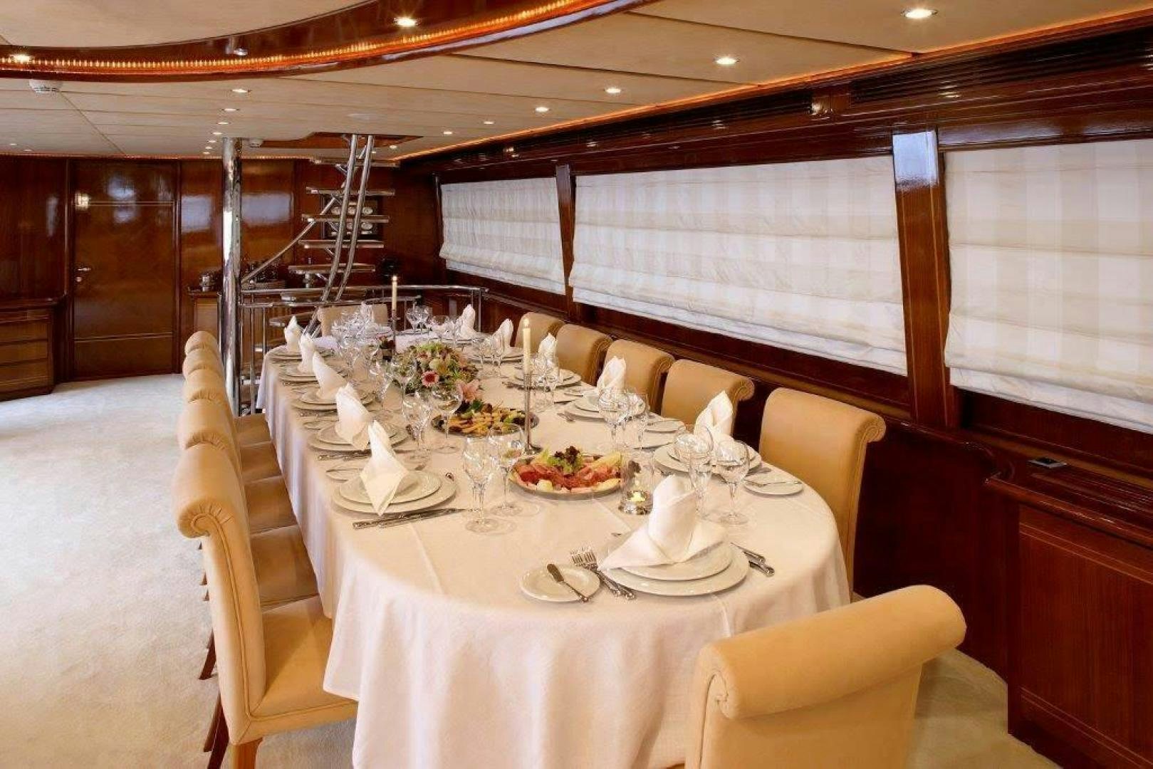 a table set for a dinner aboard CORVUS Yacht for Sale