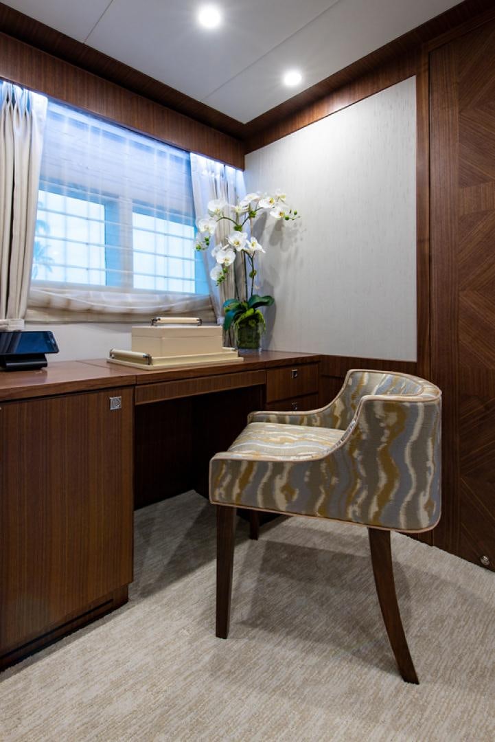 a chair and desk in a room aboard GALATI G120 SIGNATURE SERIES Yacht for Sale