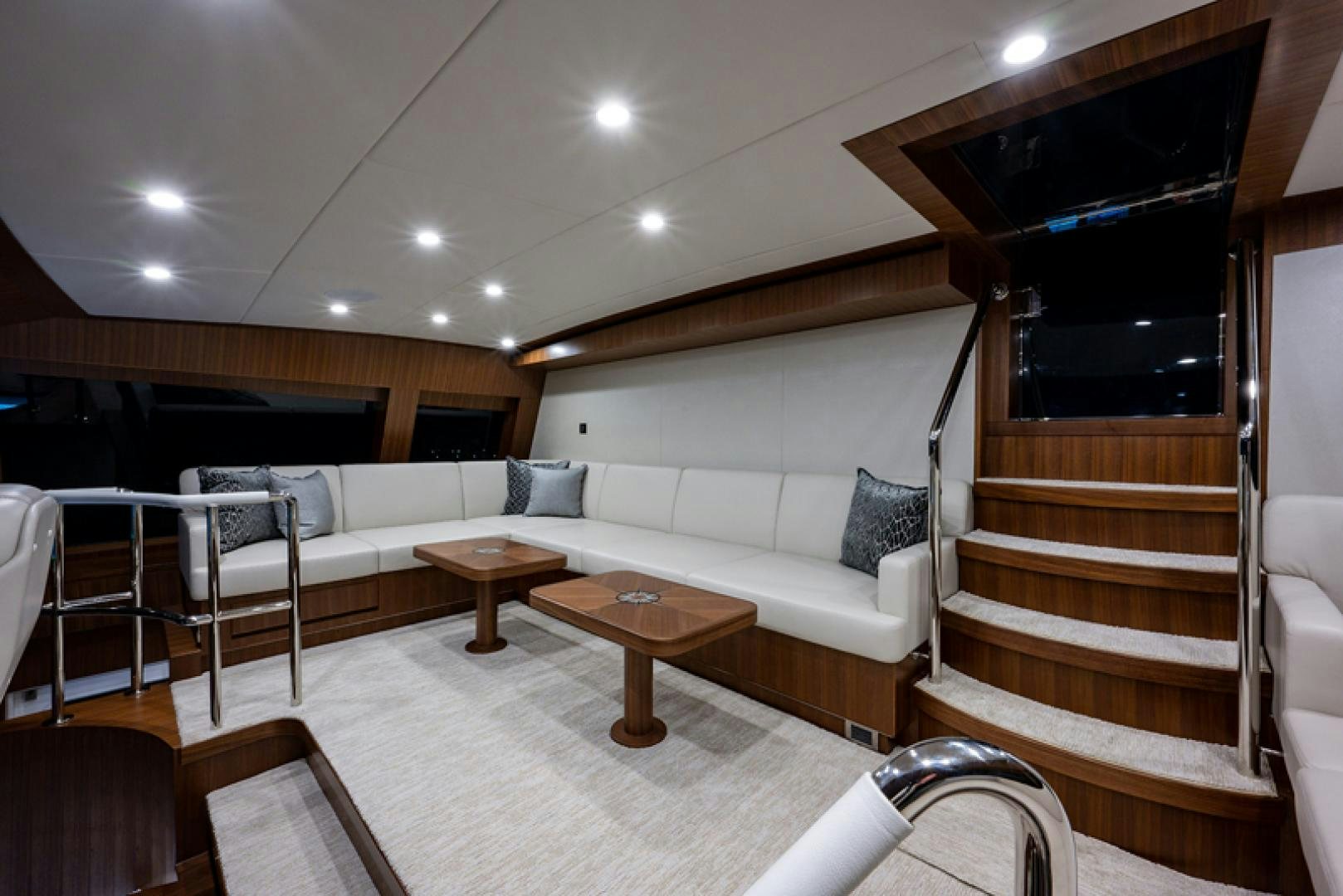 a living room with a couch and a table aboard GALATI G120 SIGNATURE SERIES Yacht for Sale