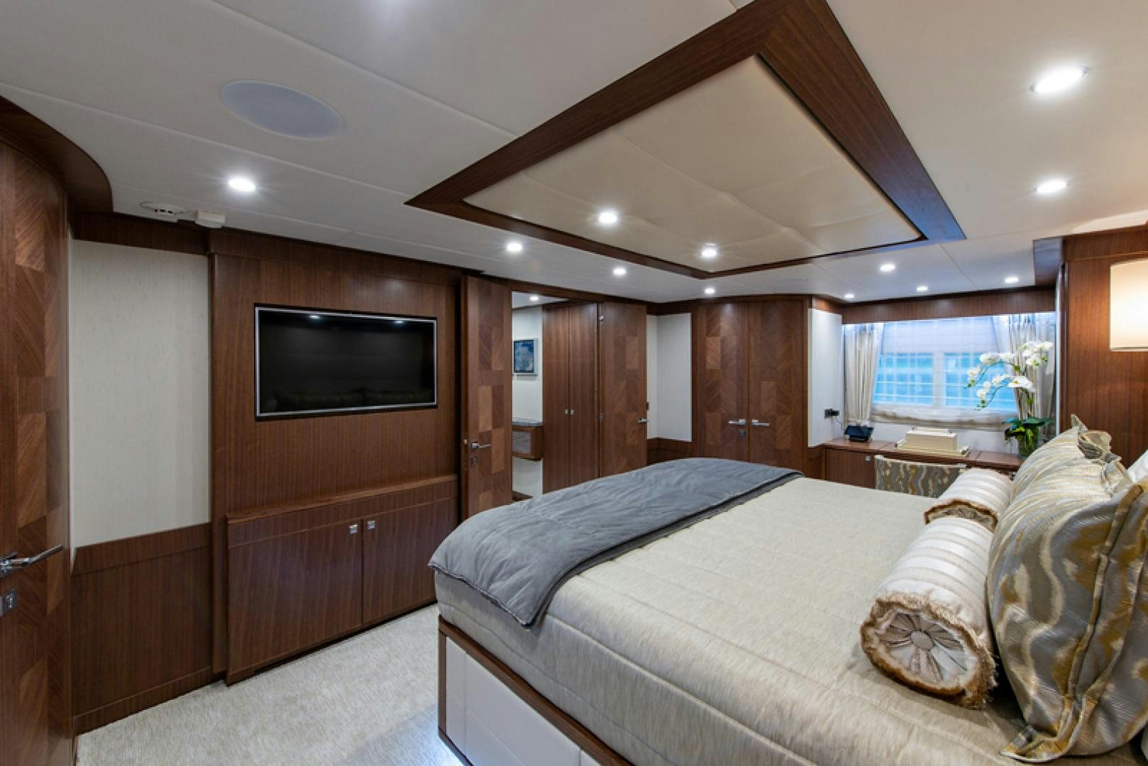 a bedroom with a bed and a television aboard GALATI G120 SIGNATURE SERIES Yacht for Sale