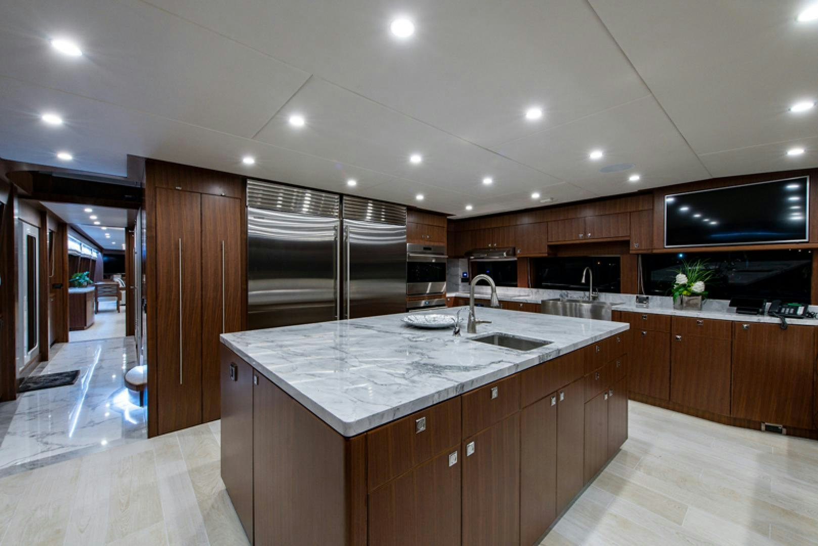 a large kitchen with a large island aboard GALATI G120 SIGNATURE SERIES Yacht for Sale