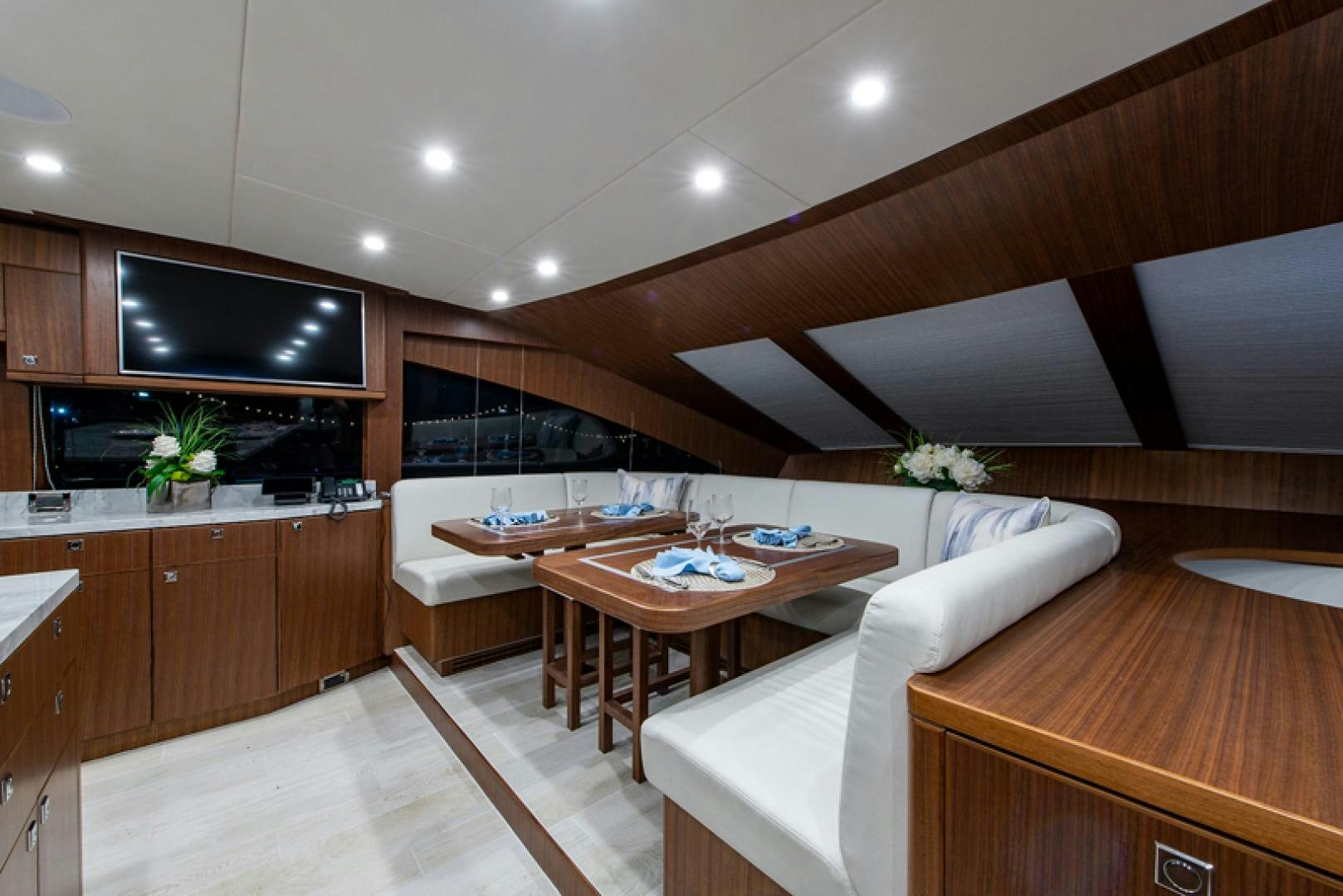 a modern kitchen with wooden cabinets aboard GALATI G120 SIGNATURE SERIES Yacht for Sale